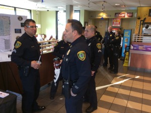 Officers reassure each other that people who like police will eventually show up.